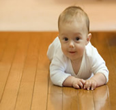 Sanded wood floor and baby